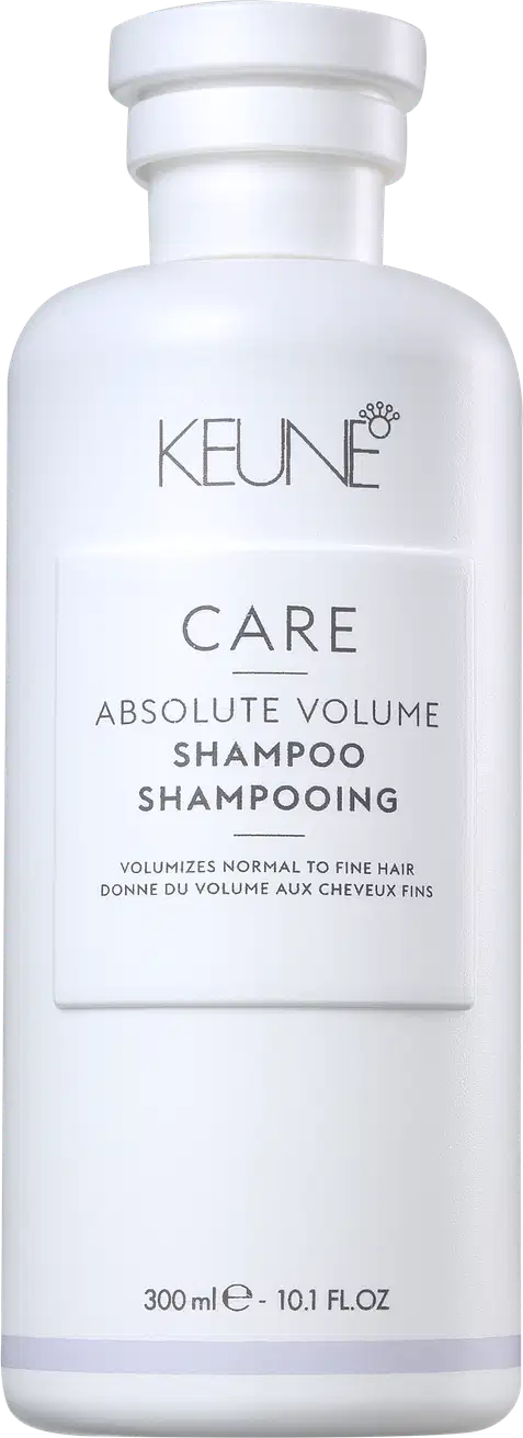 Frasco branco da linha Care da Keune, contendo Shampoo Absolute Volume. O produto é destinado a volumizar cabelos normais a finos, conforme indicado no rótulo.