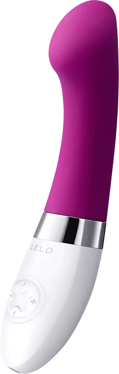 Este é um vibrador pessoal de silicone na cor roxa intensa. Possui um formato alongado e arredondado em uma extremidade. A base é branca e apresenta o logotipo "LELO" gravado. Há também alguns botões ou controles visíveis na base branca.