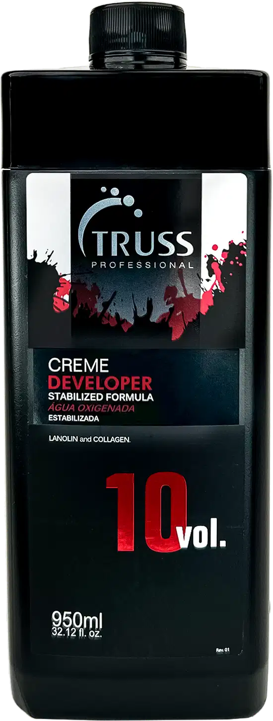 Frasco preto da marca Truss Professional contendo Creme Developer, fórmula estabilizada com 10 volumes, embalagem de 950ml, com rótulo em preto e vermelho destacando a informação de "Creme Developer".