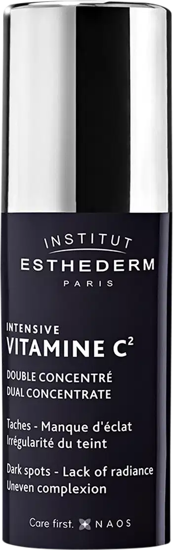 Frasco de tratamento intensivo de vitamina C2 da marca Esthederm. Embalagem preta e branca com texto destacando os benefícios do produto para manchas e falta de luminosidade da pele.