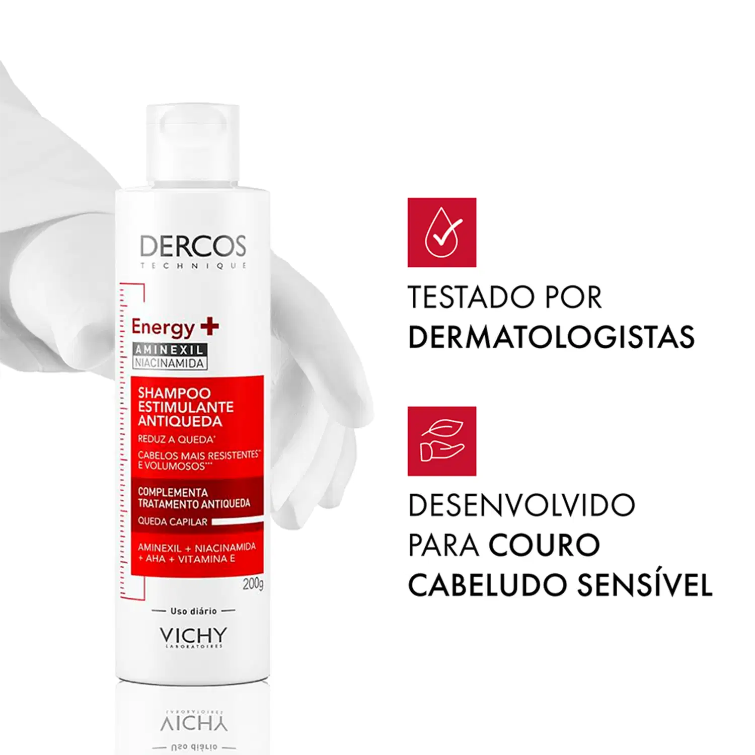 Frasco branco com rótulo vermelho da marca Dercos, contendo "Shampoo estimulante antiqueda" e informações sobre "Testado por dermatologistas" e "Desenvolvido para couro cabeludo sensível".