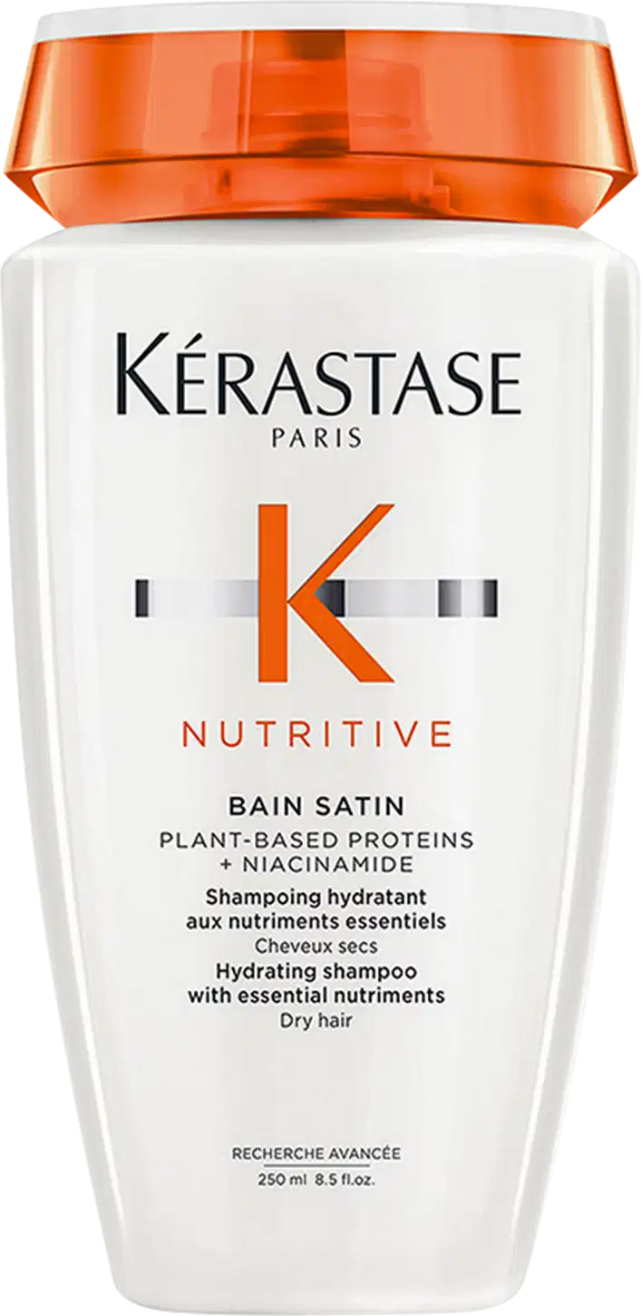 Frasco branco com tampa laranja da marca Kérastase do shampoo Nutritive Bain Satin 250ml com proteínas vegetais e niacinamida, indicado para cabelos secos.