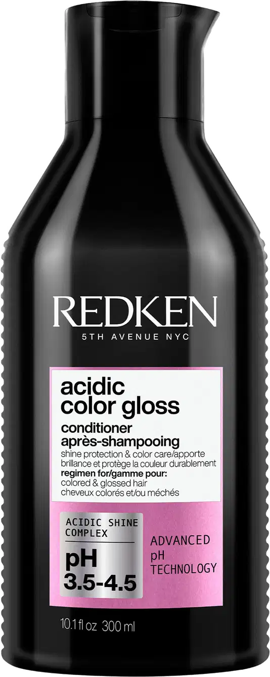 Frasco preto da linha Redken 5th Avenue NYC contendo condicionador Acidic Color Gloss, com rótulo rosa destacando o pH 3.5-4.5 e a tecnologia avançada de pH.