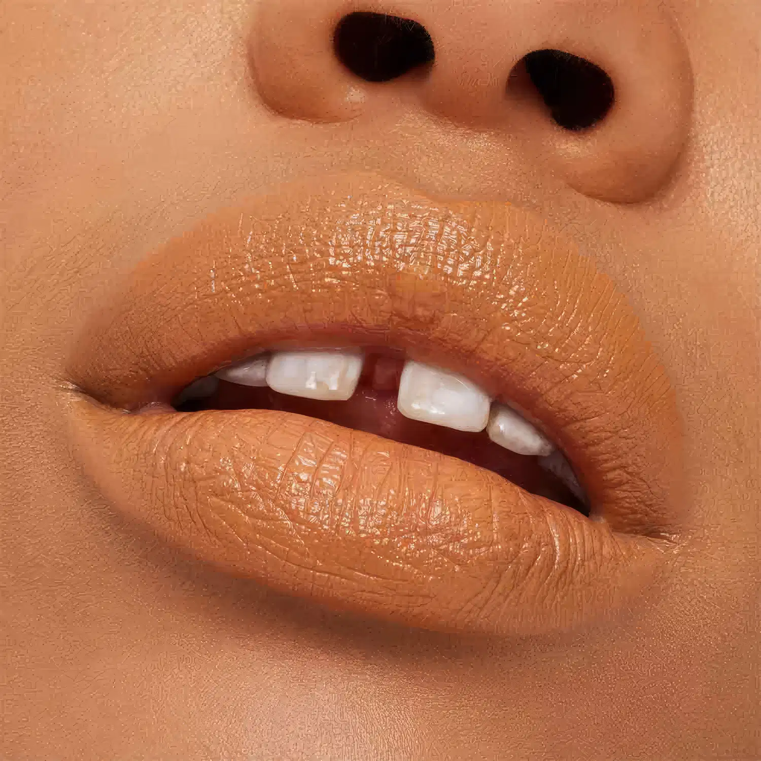 A imagem mostra a boca de uma mulher usando o batom.