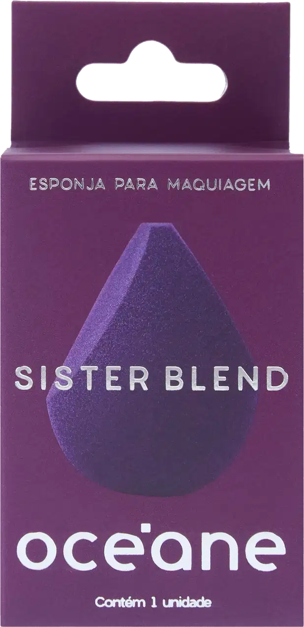 Embalagem retangular em tons de roxo, com um recorte em formato de gota na parte frontal em preto e azul escuro. Texto "Esponja para Maquiagem" e "Sister Blend" em letras brancas, além do logotipo Océane.