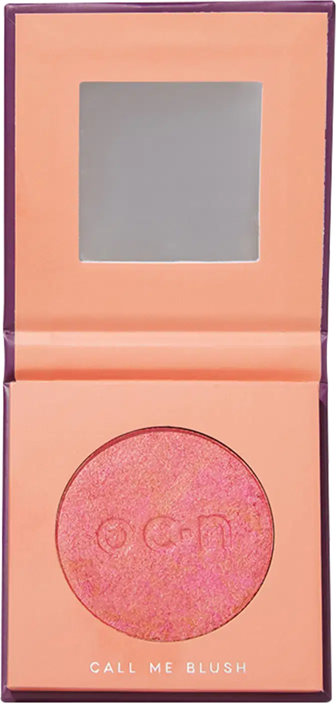 A embalagem está aberta mostrando um espelho na parte superior e o blush compacto em tom de laranja.