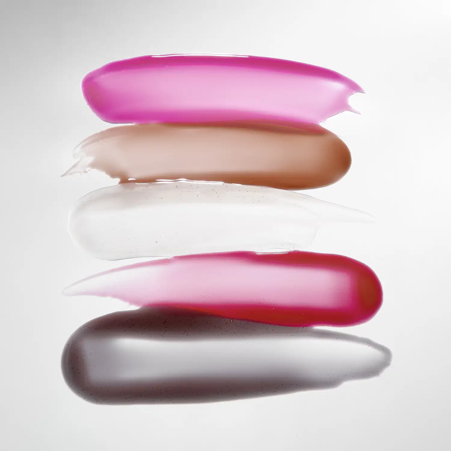Amostra das 5 cores disponíveis do Gloss Boca Rosa Hidra Lábios:  rosa, bege, transparente, vermelho e marrom.