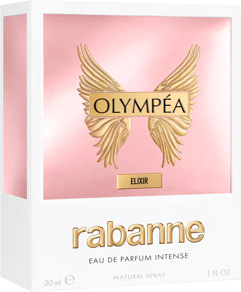 Caixa branca retangular com fundo rosa claro. Contém logotipo dourado da marca "Olympéa" e texto "Elixir" em dourado. Embalagem possui asas douradas na parte superior. 