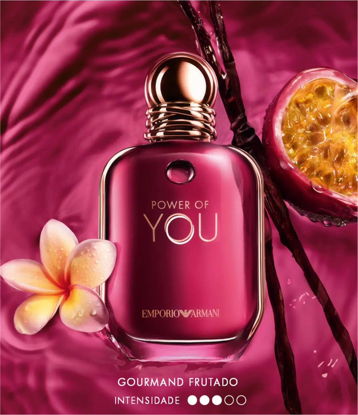 Item de perfumaria em frasco de vidro com tampa dourada, em tom de rosa escuro, com texto "POWER OF YOU" e "EMPORIO ARMANI" em dourado. Acompanhado de flor amarela e laranja. Fundo rosa intenso.