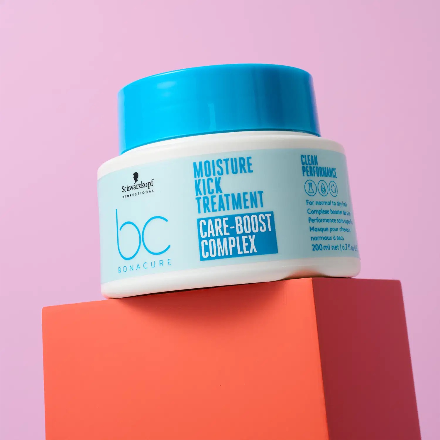 Embalagem de tratamento capilar da linha Bonacure da Schwarzkopf Professional, com design moderno e cores vibrantes de azul e laranja, em um cenário minimalista e monocromático.