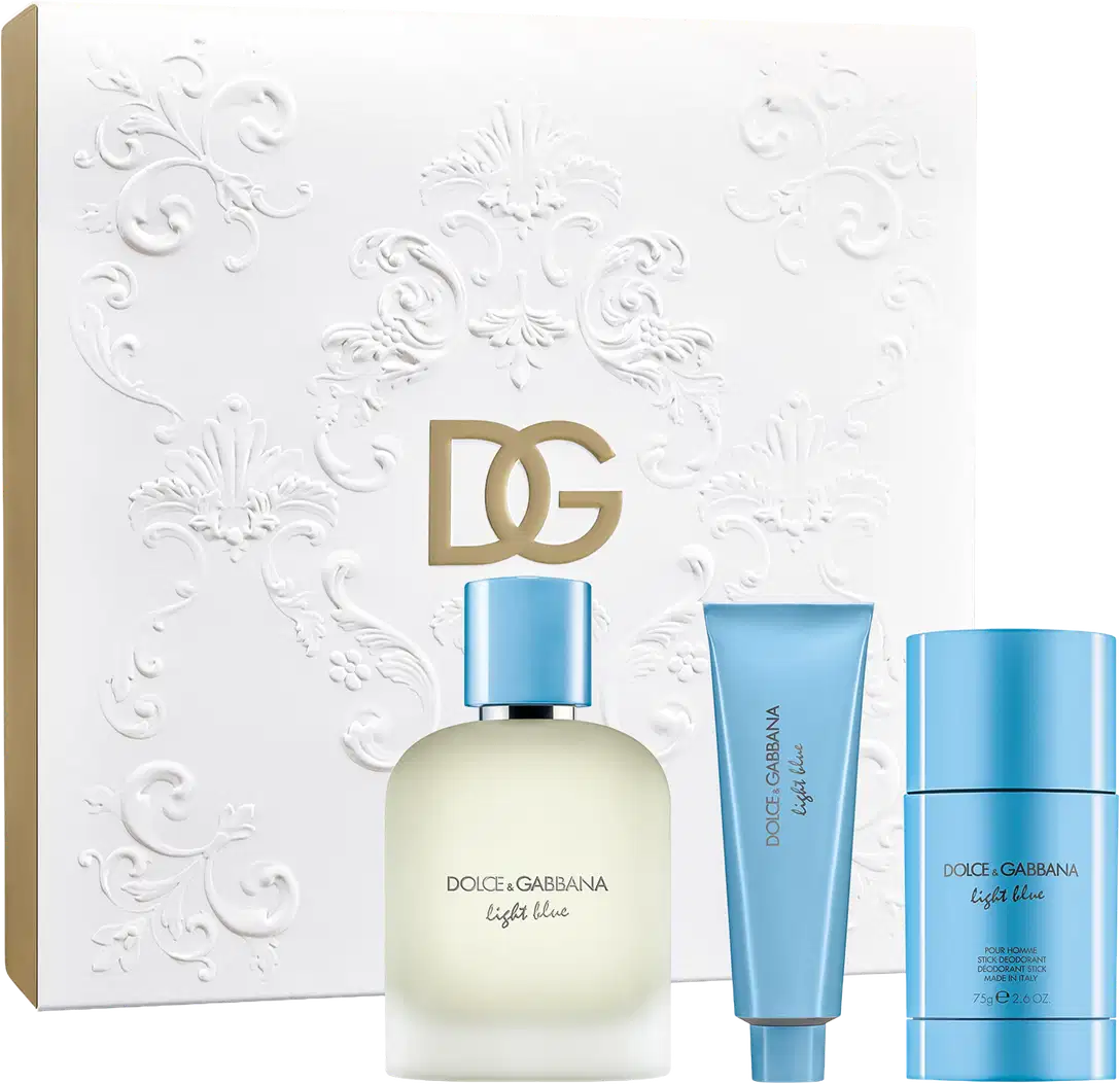 Conjunto de produtos de beleza Dolce & Gabbana Light Blue, incluindo um frasco de perfume, um tubo de shower gel e um desodorante, em uma caixa branca com detalhes florais em relevo.