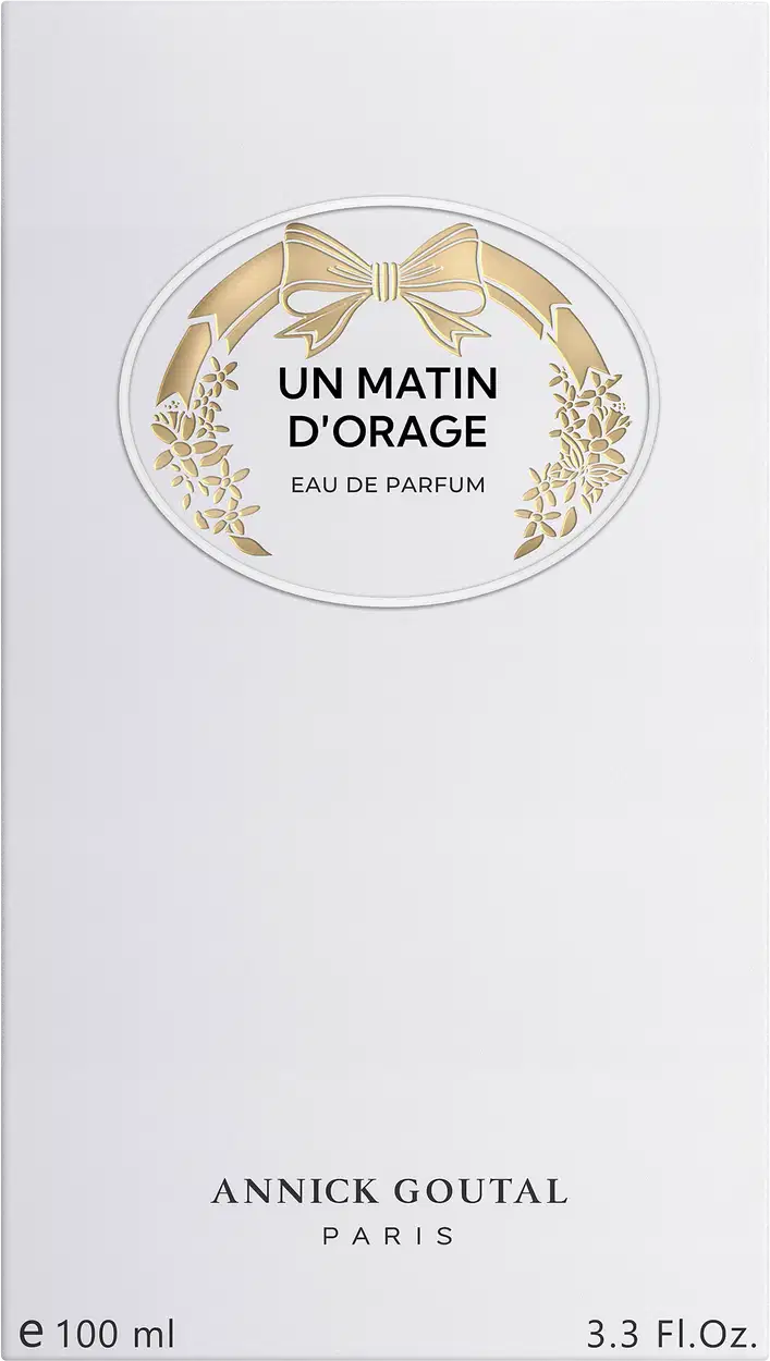 Eau de Parfum Un Matin d'Orage da Annick Goutal Paris. Embalagem branca com medalha dourada decorada com laço e flores. Frasco de 100ml (3.3 Fl.Oz). Design elegante e minimalista.