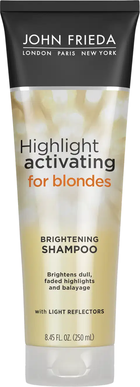 Embalagem tubular preta com detalhes dourados e texto branco. Rótulo indicando "Highlight activating for blondes Brightening Shampoo" (Shampoo ativador de luzes para loiras e iluminador). Menciona que ilumina luzes opacas, realça e revitaliza a cor.