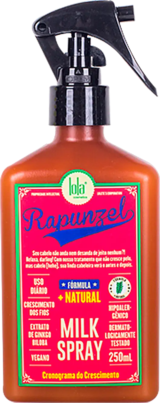 Frasco de spray de leite da marca Lola From Rio, com rótulo rosa e verde destacando a fórmula natural e vegana do produto. O frasco possui um gatilho preto e contém 250 ml do produto.