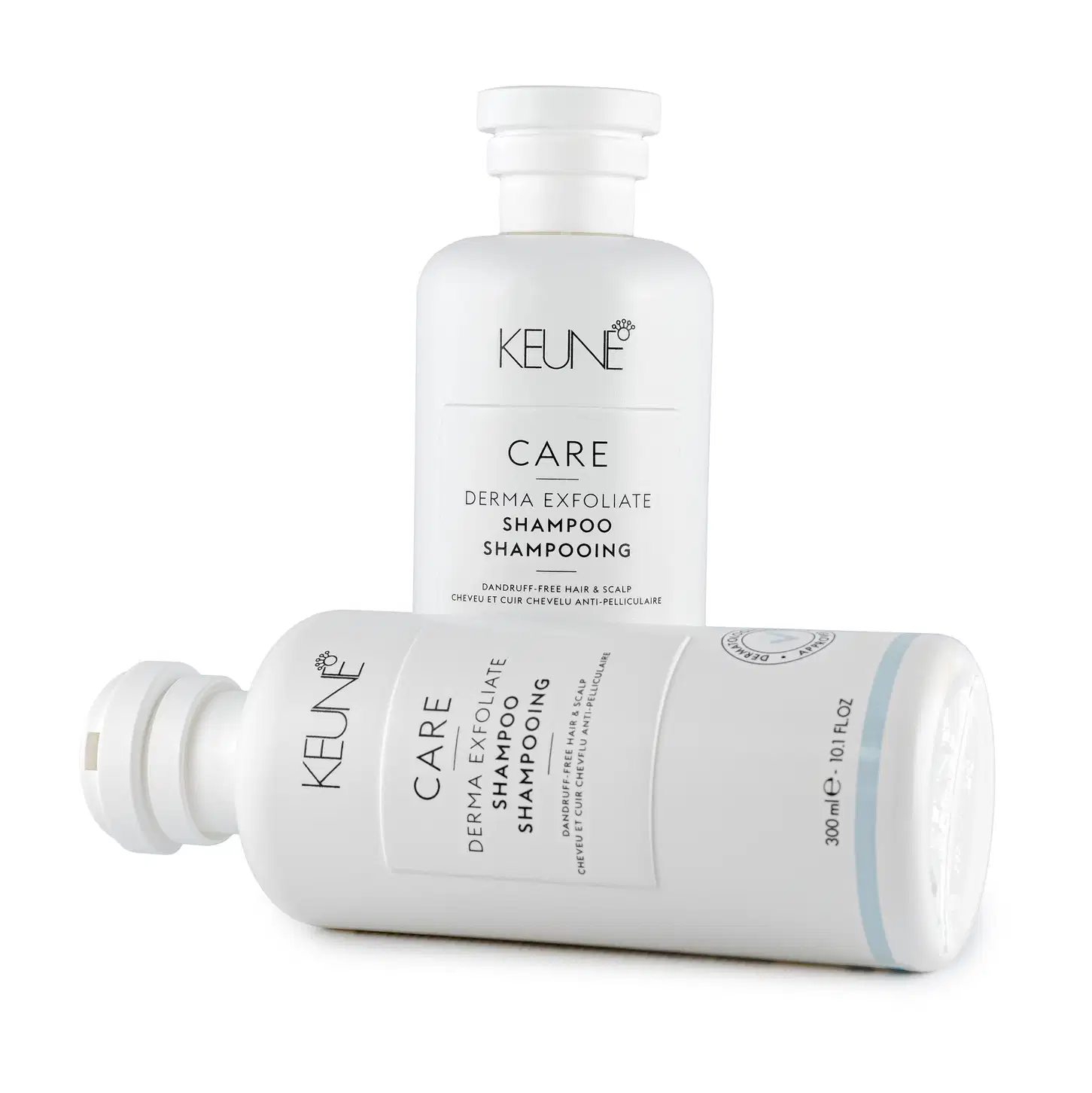 Frasco branco de shampoo Keune Care Derma Exfoliate, com rótulo em preto e branco indicando o nome do produto e sua função de remover caspa do couro cabeludo.