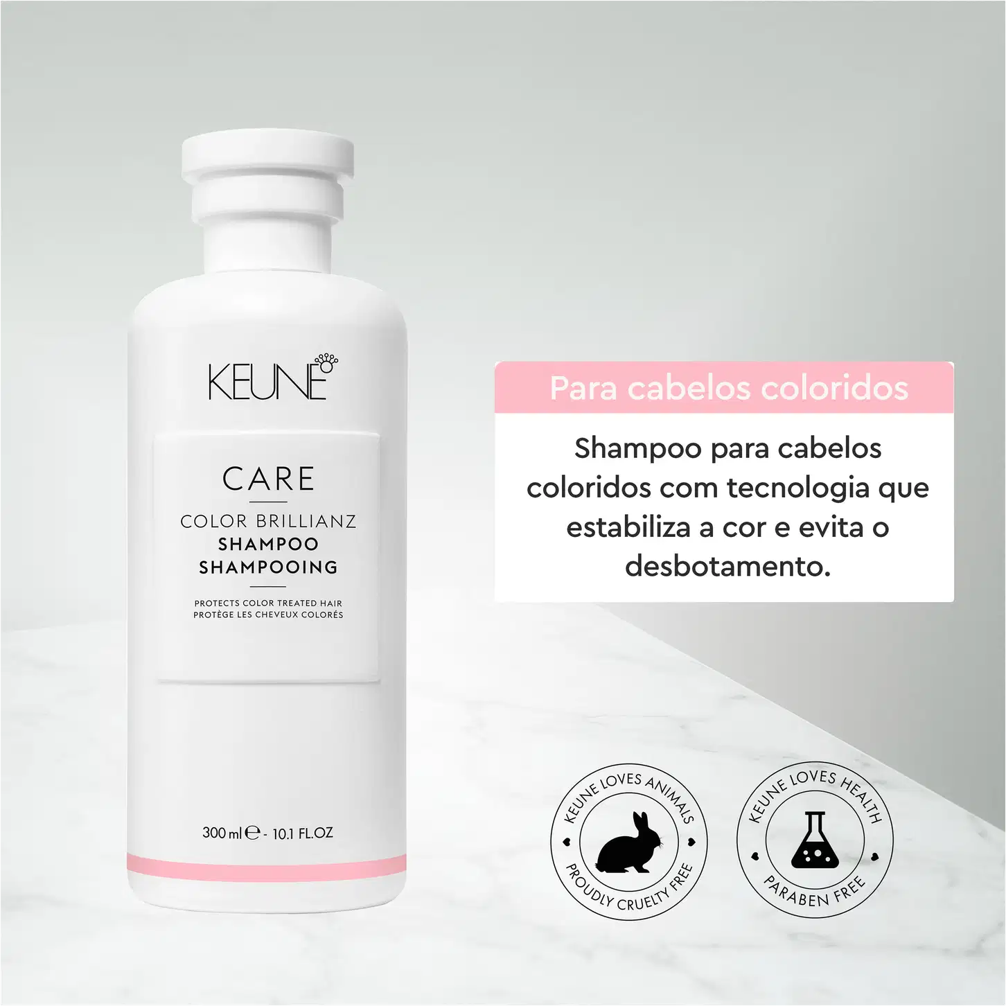Frasco branco da linha Care da Keune, contendo Shampoo Color Brillianz para proteção de cabelos coloridos. Rótulo com nome do produto e informações sobre sua função de proteger a cor dos cabelos.