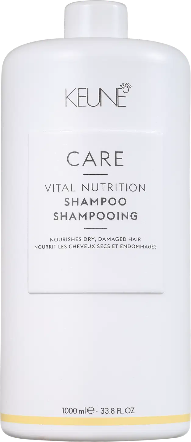 Frasco branco da linha Keune Care Vital Nutrition, contendo shampoo para cabelos secos e danificados. Rótulo com nome do produto e informações sobre o uso.