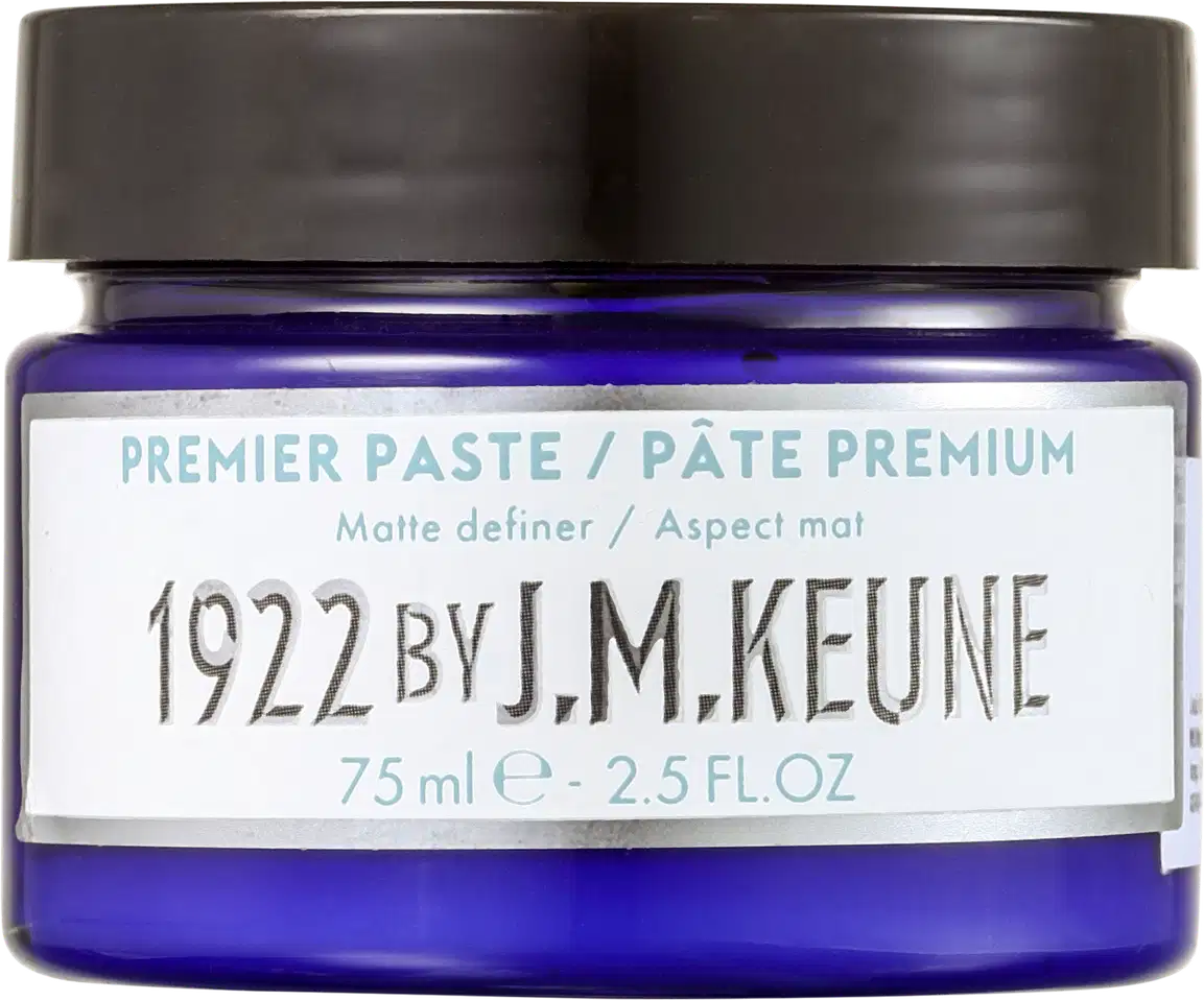 Pote de pasta premium da marca Keune, com tampa preta e rótulo branco contendo informações sobre o produto, incluindo o nome "J.M. Keune" e o volume de 75 ml.