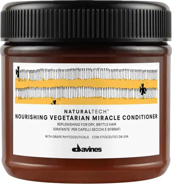 Frasco de condicionador de cabelo Naturaltech da Davines, com tampa preta e rótulo com informações sobre o produto, que promete nutrir e reparar cabelos secos e quebradiços.