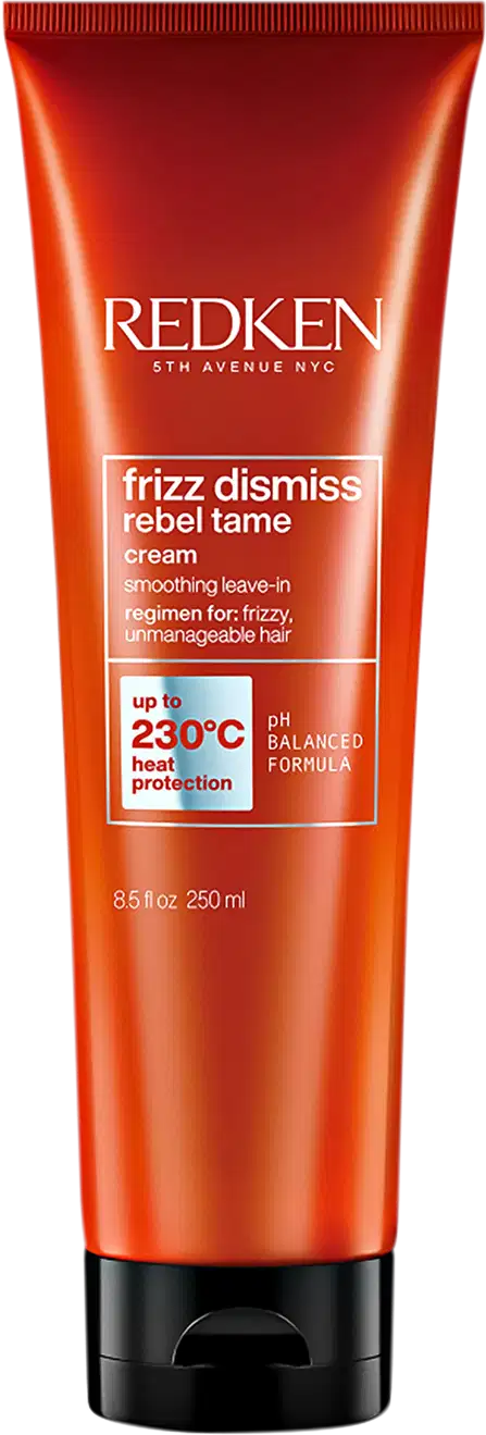 Tubo de creme para cabelos da marca Redken, com design vermelho e preto. Rótulo indica que o produto é da linha "Frizz Dismiss Rebel Tame" e promete controle de frizz com proteção térmica de até 230°C.