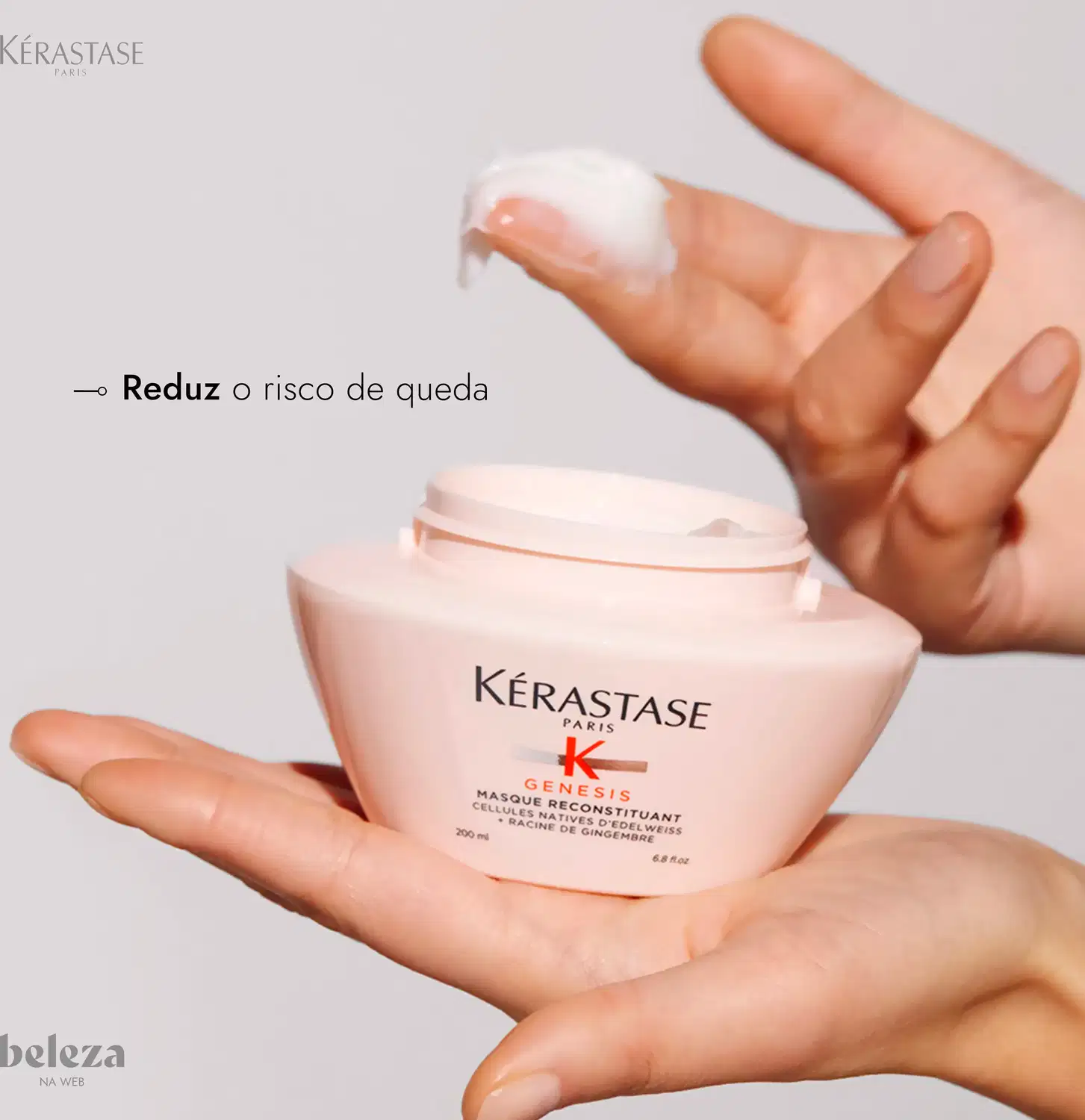 Frasco de creme capilar Kérastase Genesis, com embalagem branca e rosa, contendo texto em português "Reduz o risco de queda" e informações sobre o produto.