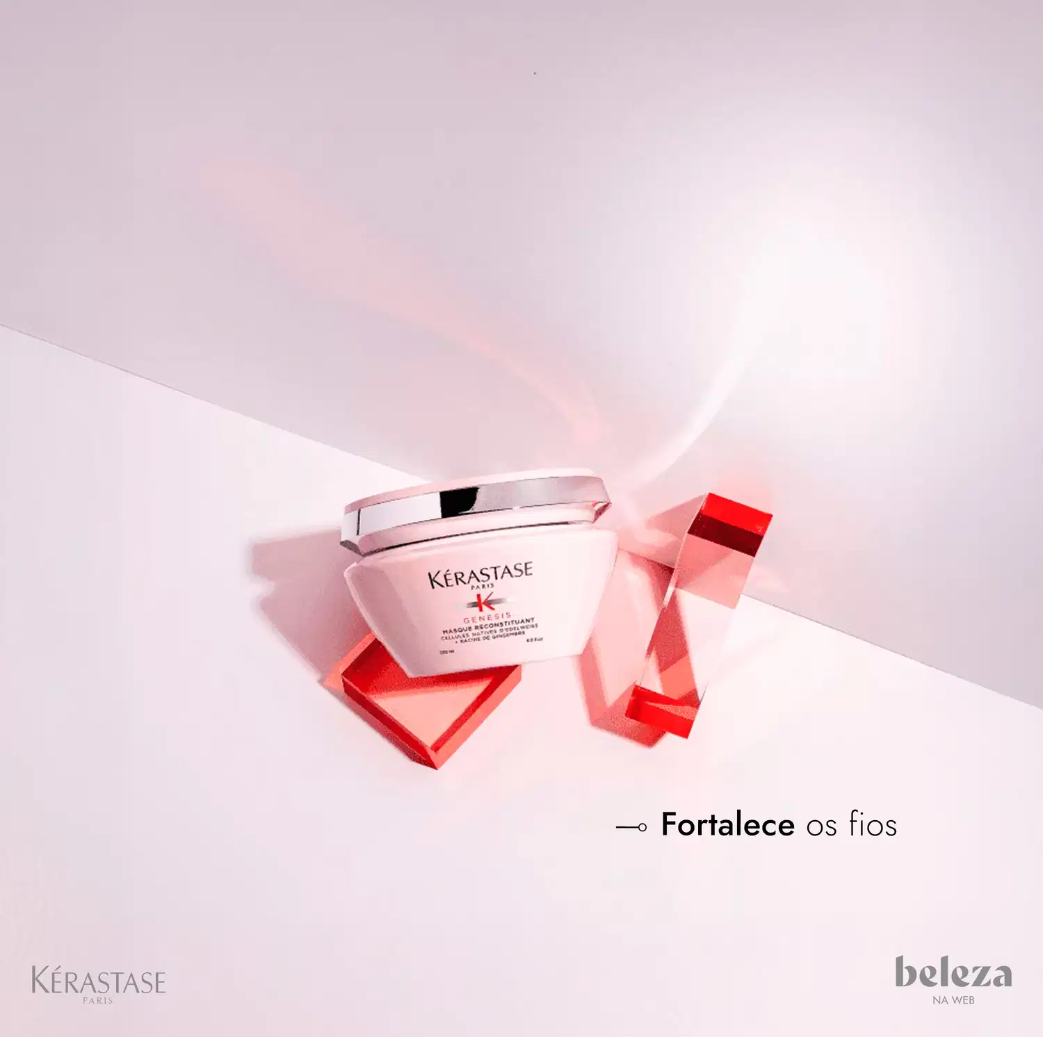 Frasco de tratamento capilar Kérastase Résistance, com embalagem branca e detalhes em vermelho, sobre fundo claro com elementos geométricos em vermelho.