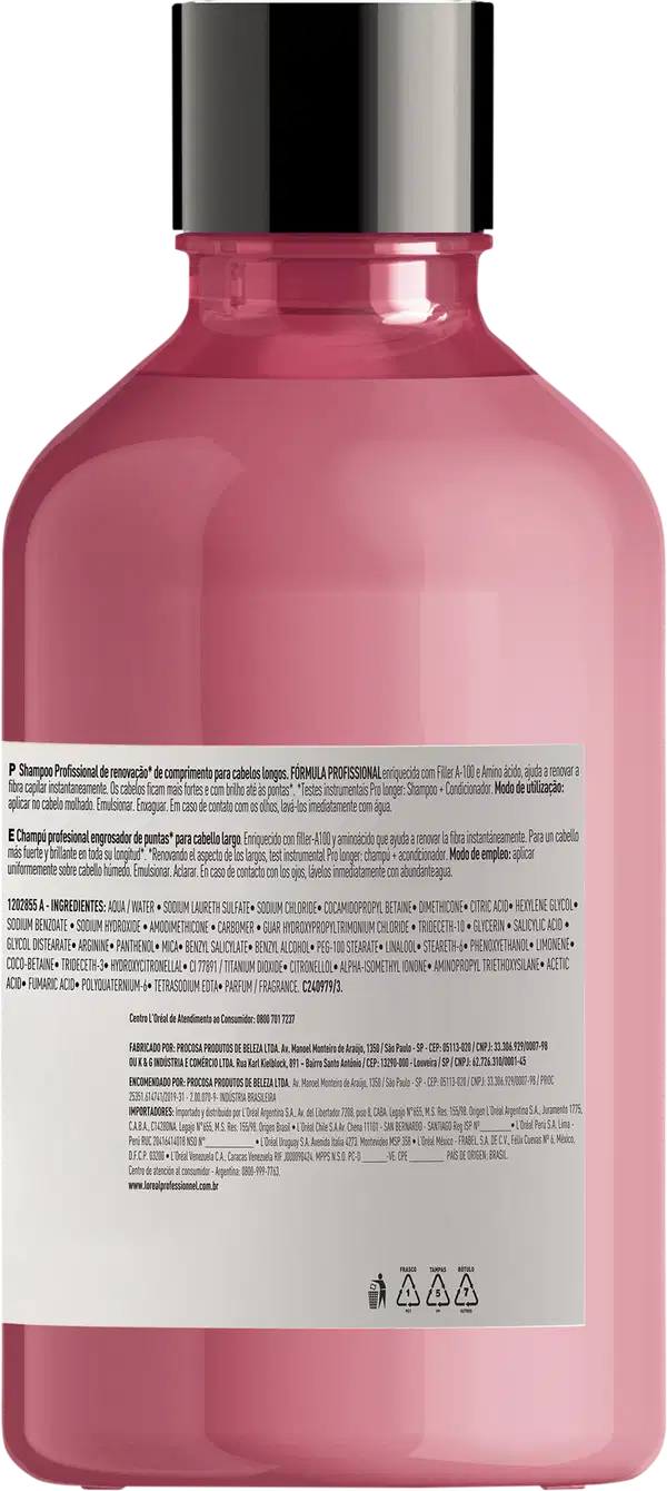 Frasco plástico rosa com tampa preta para produtos de cuidados capilares profissionais. O rótulo na parte inferior lista os ingredientes e informações do produto em letras pequenas. Três símbolos de reciclagem aparecem na parte inferior do frasco.