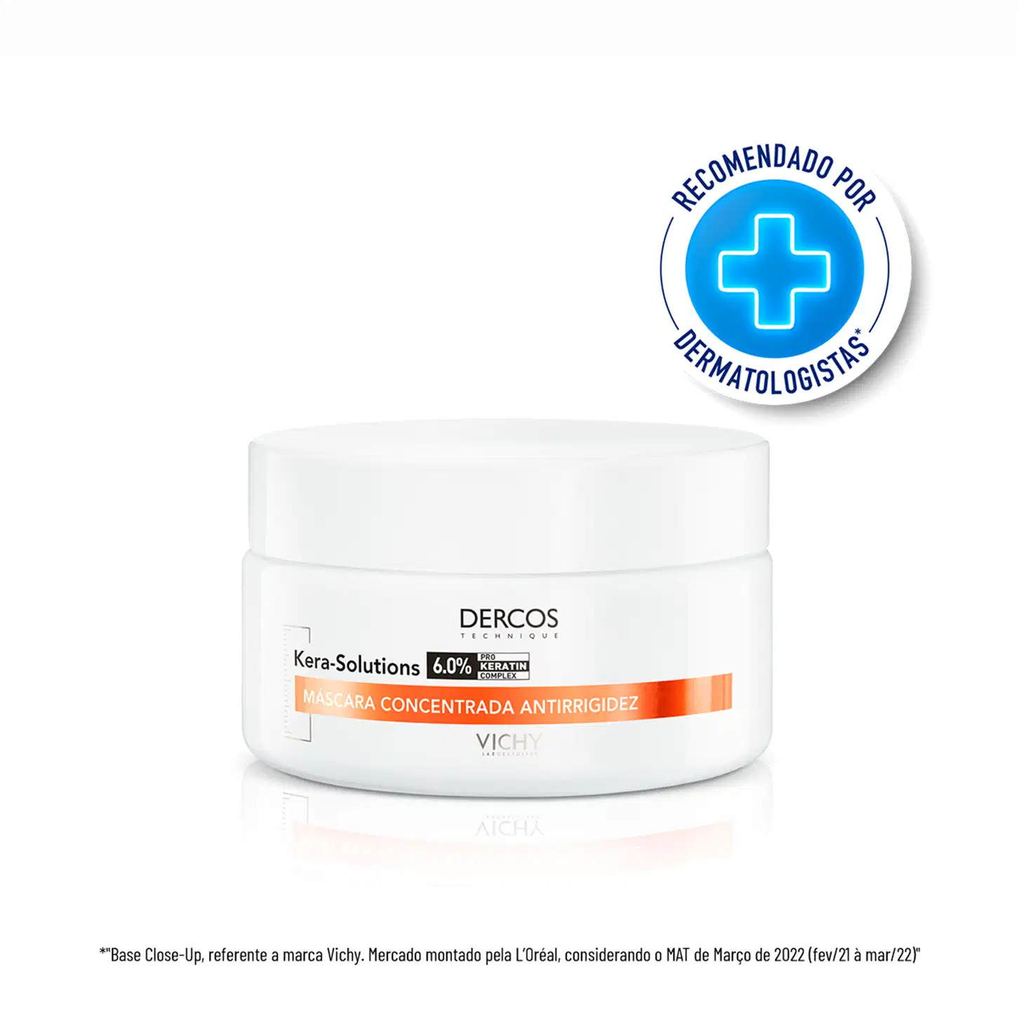 Frasco branco de máscara concentrada antirrigidez da marca Dercos, com 6,0% de queratina. Rótulo com logotipo azul e texto em espanhol indicando recomendação por dermatologistas.