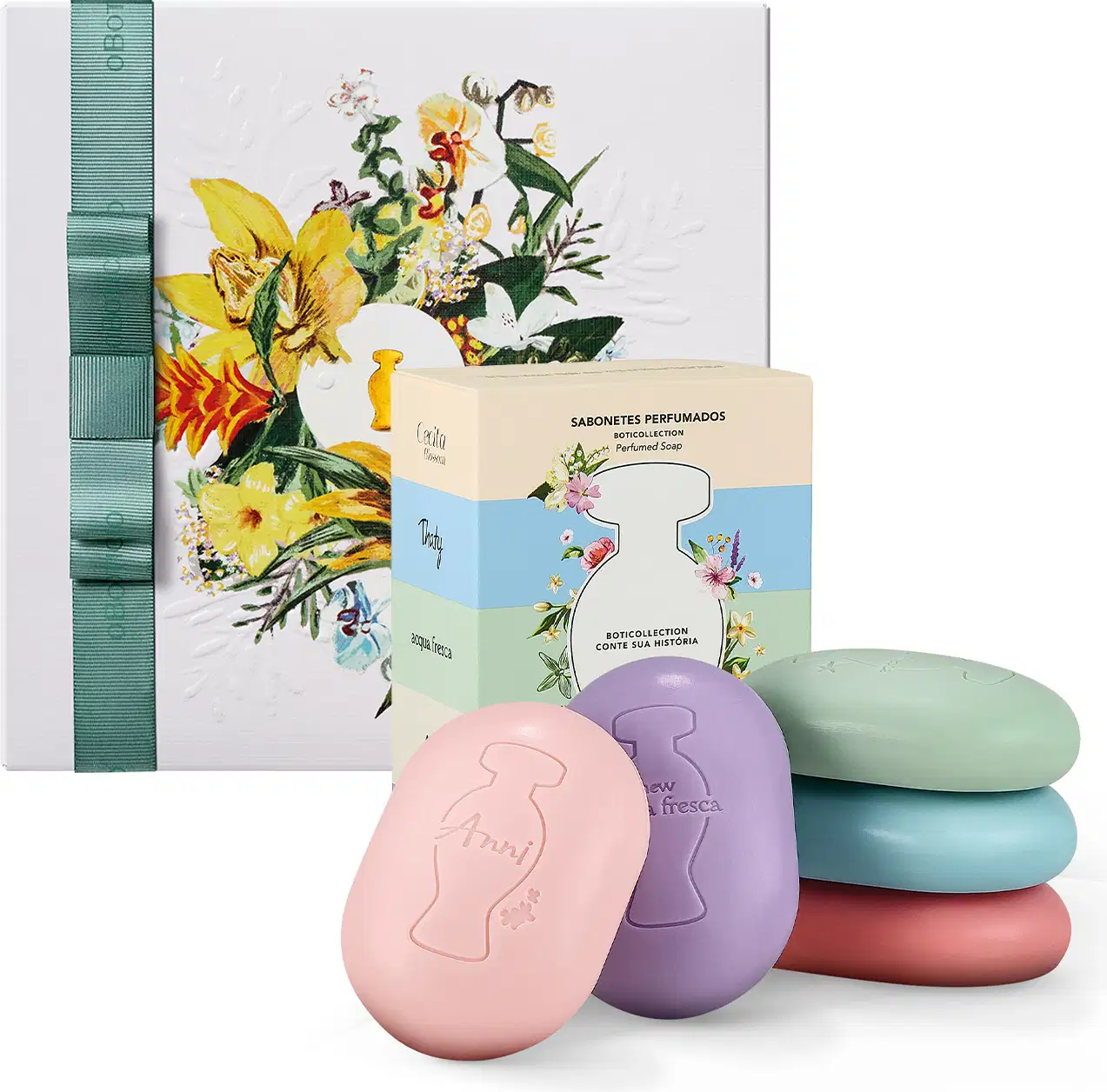 Caixa de presente com sabonetes perfumados em formatos de ovos coloridos, embalados em caixa com ilustração floral. Conjunto de sabonetes em tons pastel de rosa, roxo, azul e vermelho.