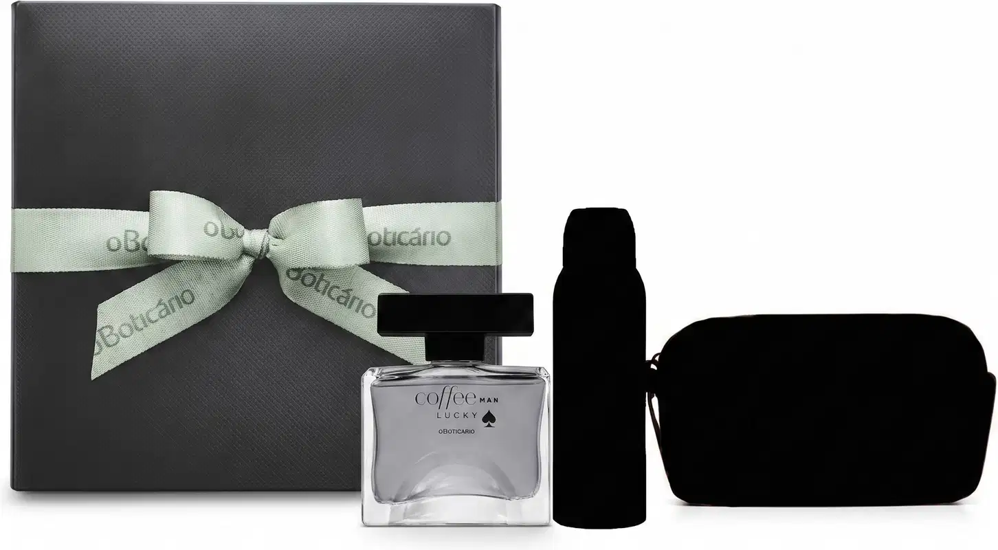 Caixa de presente cinza com laço verde-claro com logo oBoticário e  frasco de fragrância transparente da linha Coffee Man Lucky, além de silhueta de dois itens surpresa, conjunto de itens de perfumaria da marca Boticário.