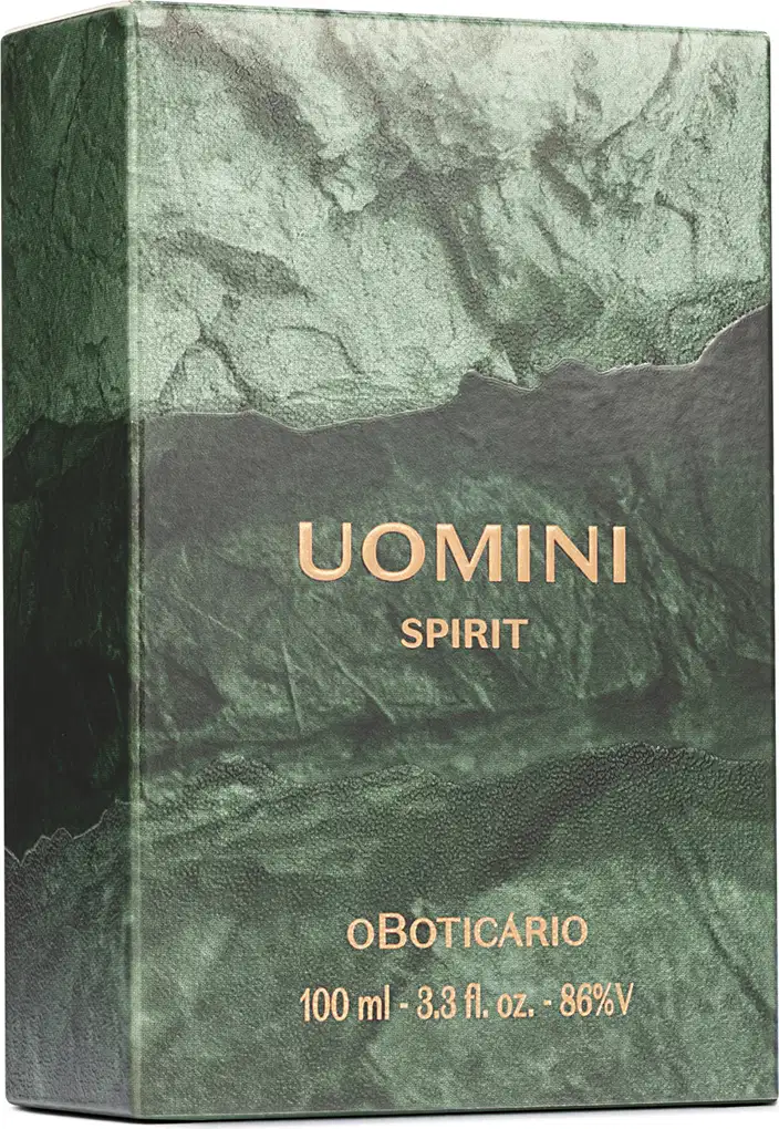 Caixa de desodorante colônia Uomini Spirit. Embalagem retangular em tons de verde e cinza, com textura semelhante a mármore. Texto com o nome da fragrância em letras douradas na parte frontal.
