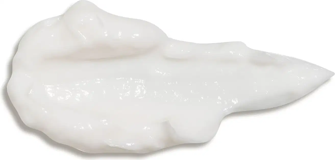 Textura branca, brilhante e cremosa de loção hidratante corporal Nativa SPA Lilac em superfície lisa e fundo branco.