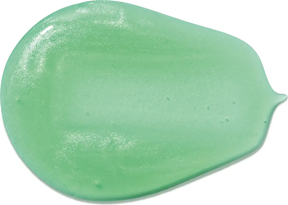 Imagem da textura verde-clara, brilhante e gelatinosa, com superfície lisa e uniforme do shampoo infantil para cabelos crespos Dr. Botica.