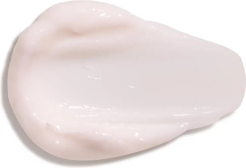 Textura cremosa e brilhante de creme hidratante para as mãos Cuide-se Bem Deleite em tom rosado claro, com superfície lisa e uniforme, ocupando a maior parte da imagem.