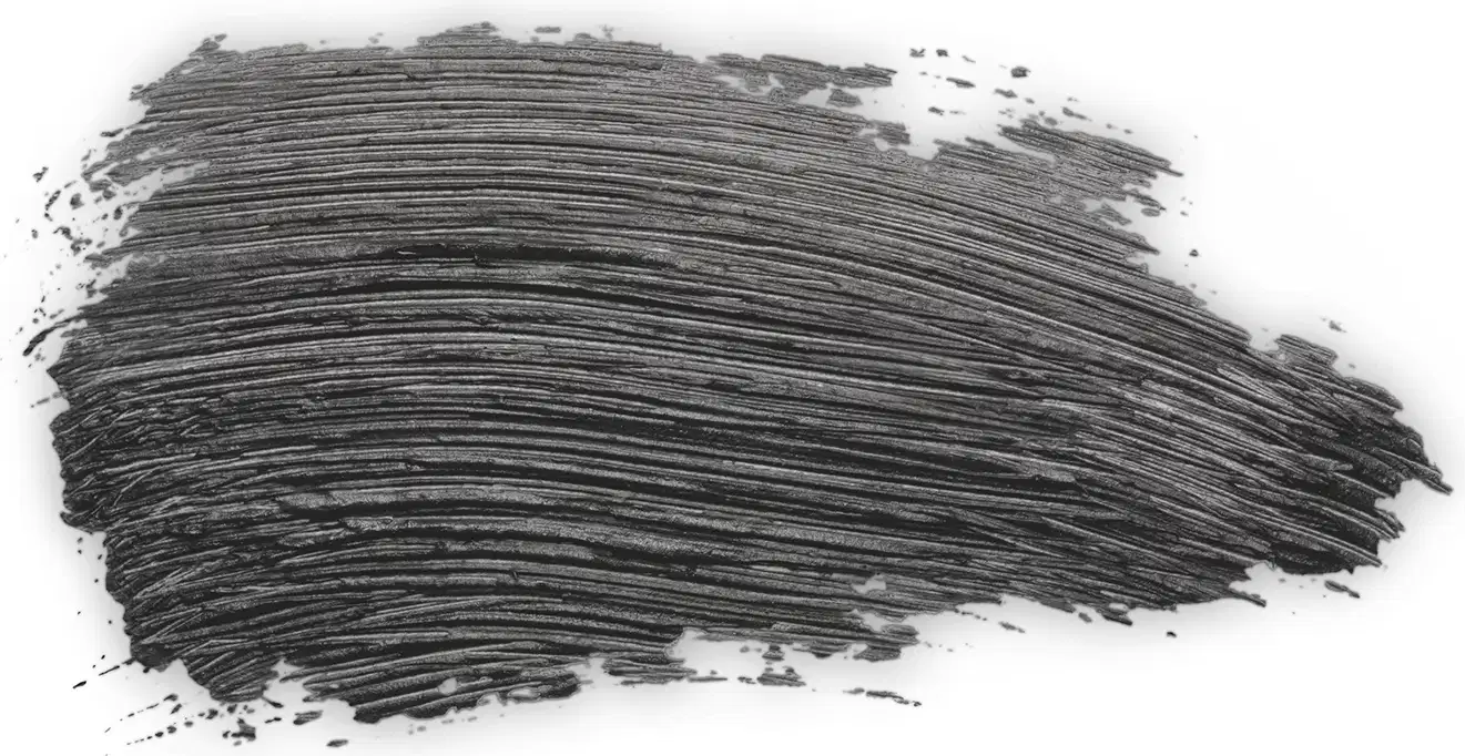 Textura escura e espessa de mascara para cílios Make B. Explosion Grow com acabamento brilhante e superfície irregular, aparentando consistência cremosa ou pastosa.