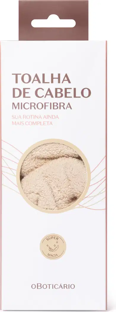 Toalha de cabelo microfibra da marca O Boticário, em embalagem retangular branca com detalhes em marrom, apresentando texto informativo sobre o produto.