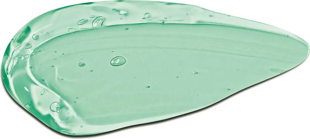 Textura verde-clara, brilhante e transparente com pequenas bolhas, em superfície plana e lisa da geleia desodorante refrescante corporal da marca Cuide-se Bem Bob Esponja e Amigos com consistência de gel.