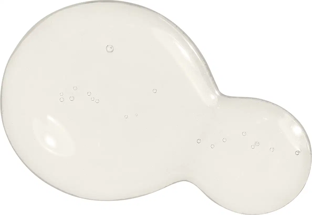 Textura do sérum antioleosidade Malbec Facial com aspecto gelatinoso, brilhante e transparente, com pequenas bolhas dispersas sobre uma superfície lisa e uniforme.