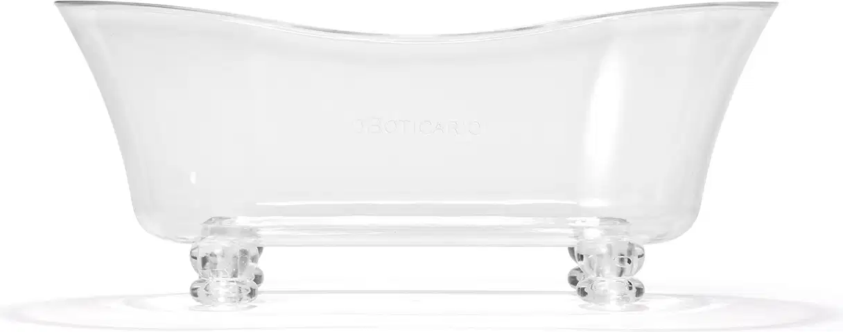 Banheira em acrílico branco em formato oval alongado com bordas arredondadas. Base retangular transparente com quatro pés arredondados. Superfície lisa e brilhante. Design minimalista e elegante, adequado para ambientes de spa e banheiros luxuosos.