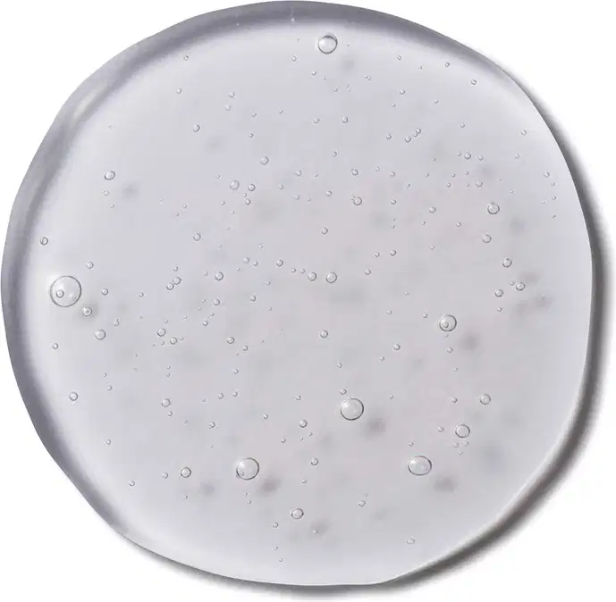 Imagem da textura transparente e brilhante do Shampoo Cuide-se Bem Feira Vinagre de Maçã, com pequenas bolhas de ar dispersas pela superfície.