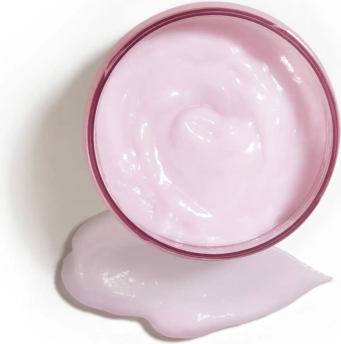 Potede creme hidratante corporal Liz Flora aberto, mostrando o creme branco dentro do recipiente e um pouco do produto espalhado na superfície branca.