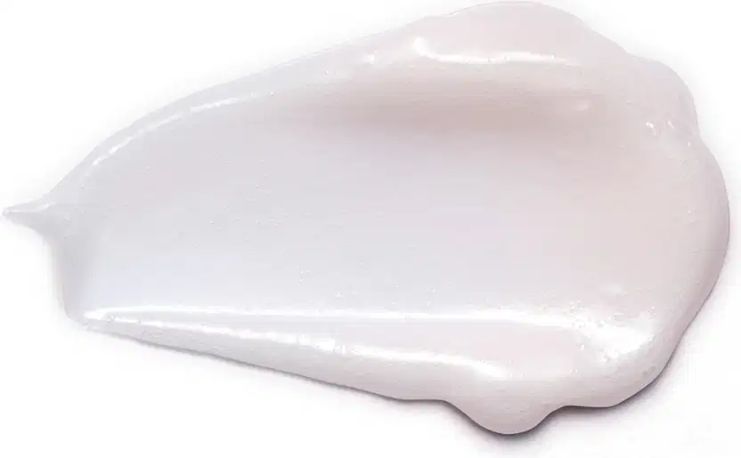 Textura cremosa e brilhante de creme de limpeza facial Botik  Resveratrol e Silício em fundo branco, com superfície lisa e aparência translúcida.