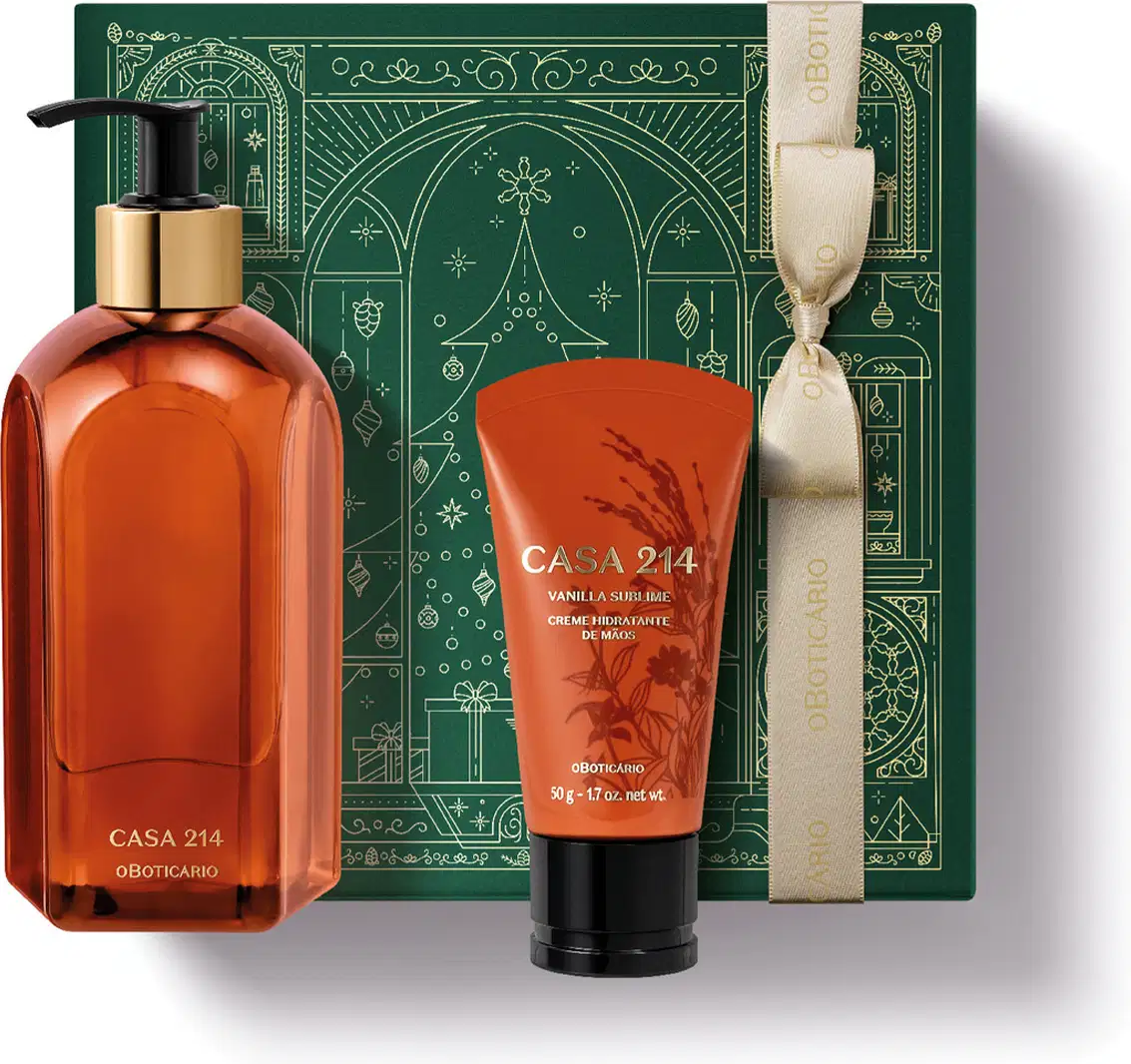 Caixa verde com detalhes dourados e dois itens da marca Casa 214 Vanilla Sublime, sendo uma bisnaga laranja com letras douradas e tampa preta de creme hidratante de mãos e um vidro laranja com bomba dosadora preta de sabonete líquido.