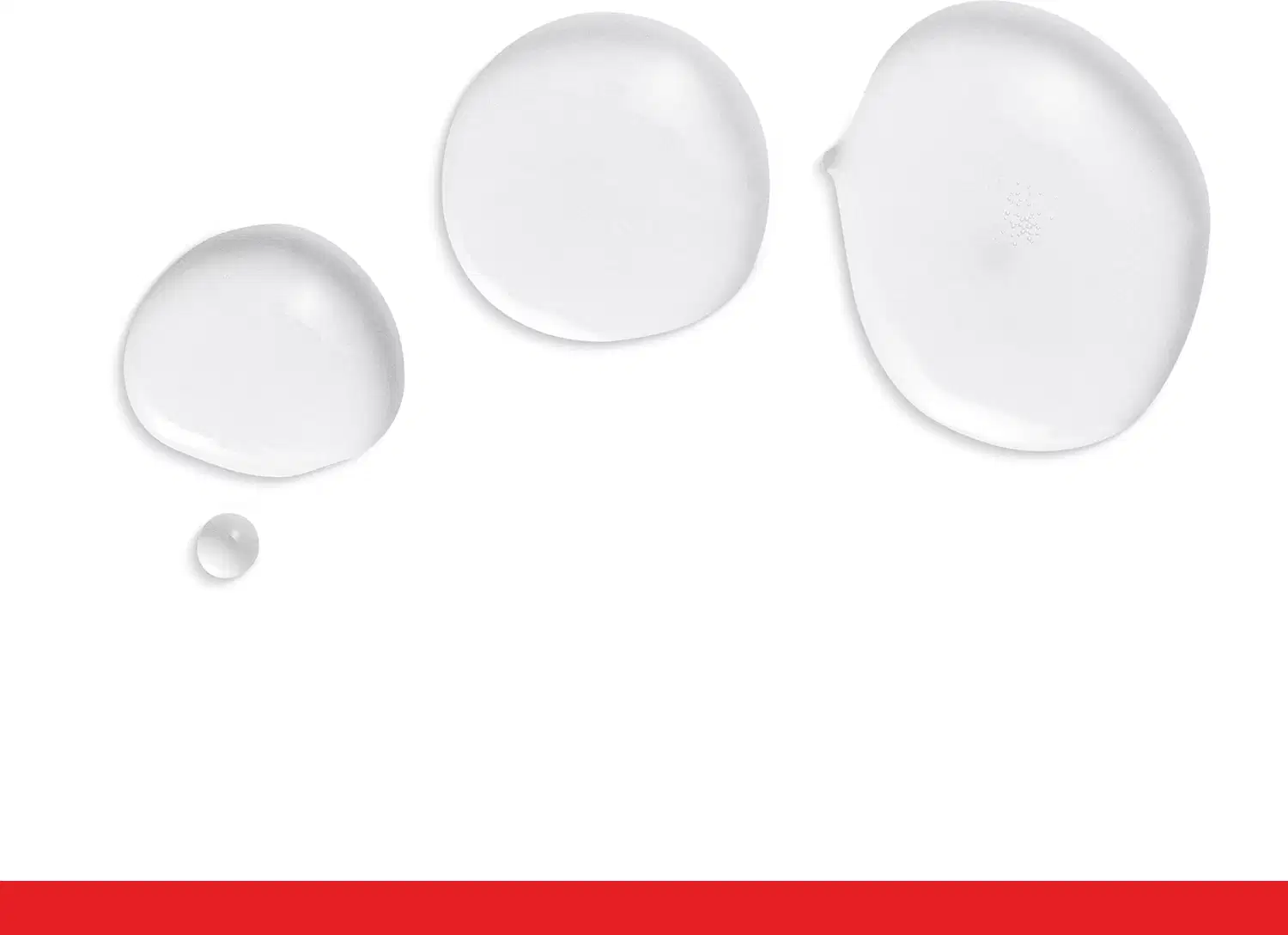 Três esferas transparentes de diferentes tamanhos com superfície lisa e brilhante, sugerindo uma textura aquosa.