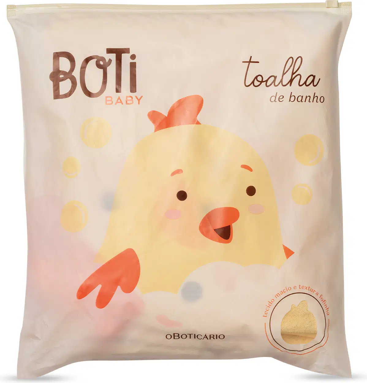 Embalagem de toalha de banho da linha Boti Baby, com ilustração de um pintinho amarelo e texto em marrom e laranja. Produto com textura e maciez indicadas na embalagem.
