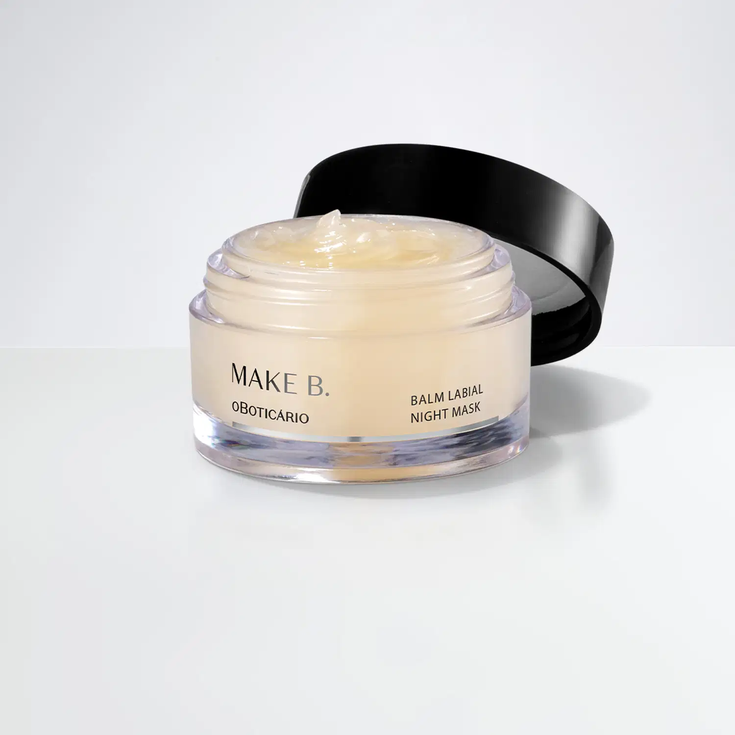 O pote é redondo, com uma tampa preta contém um creme de aparência cremosa e brilhante. O rótulo do produto indica que se trata do balm labial noturno da marca Make B. Lip Chronology Night Mask.