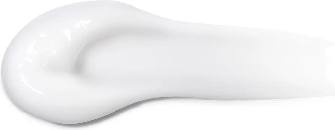 Textura branca, cremosa e brilhante de um item para corpo e balho, com superfície lisa e uniforme, ocupando a maior parte da imagem.