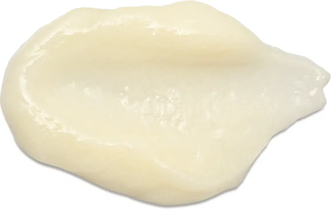 Textura cremosa e brilhante, com aparência suave e sedosa. Cor predominante é um tom amarelo pálido, característico do creme hidratante corporal da marca Liz Aura.