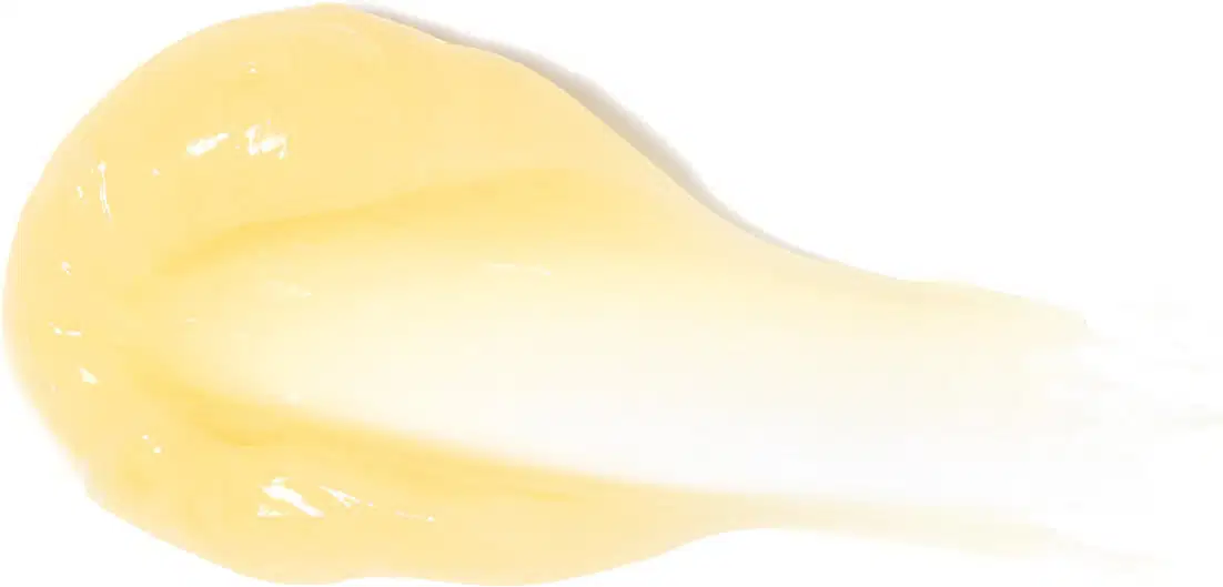 Imagem de textura cremosa e brilhante de máscara capilar em tom amarelo claro, com superfície lisa e uniforme, ocupando a maior parte da imagem em fundo branco.