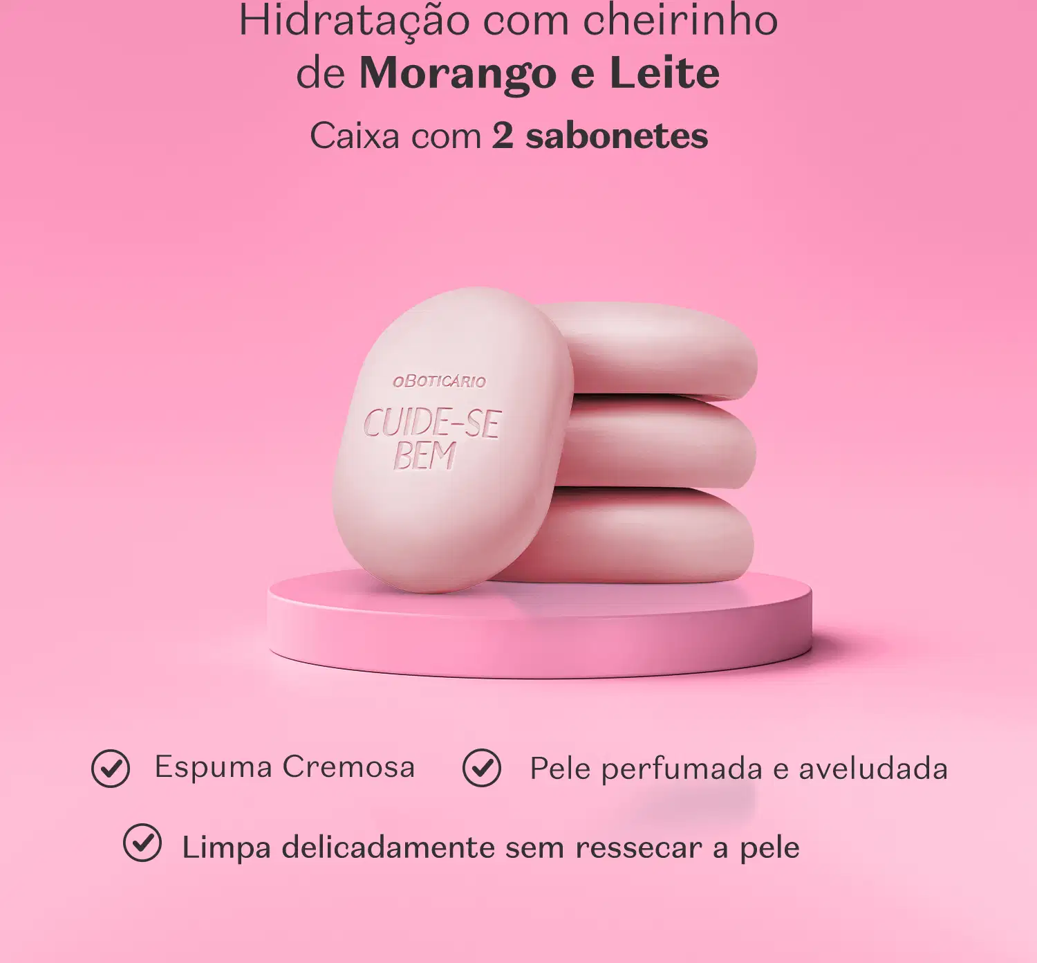 Imagem de quatro sabonetes em barra rosa da marca Cuide-se Bem Morango e Leite em superfície e fundo rosa, com letras pretas informando os benefícios e as características do produto.